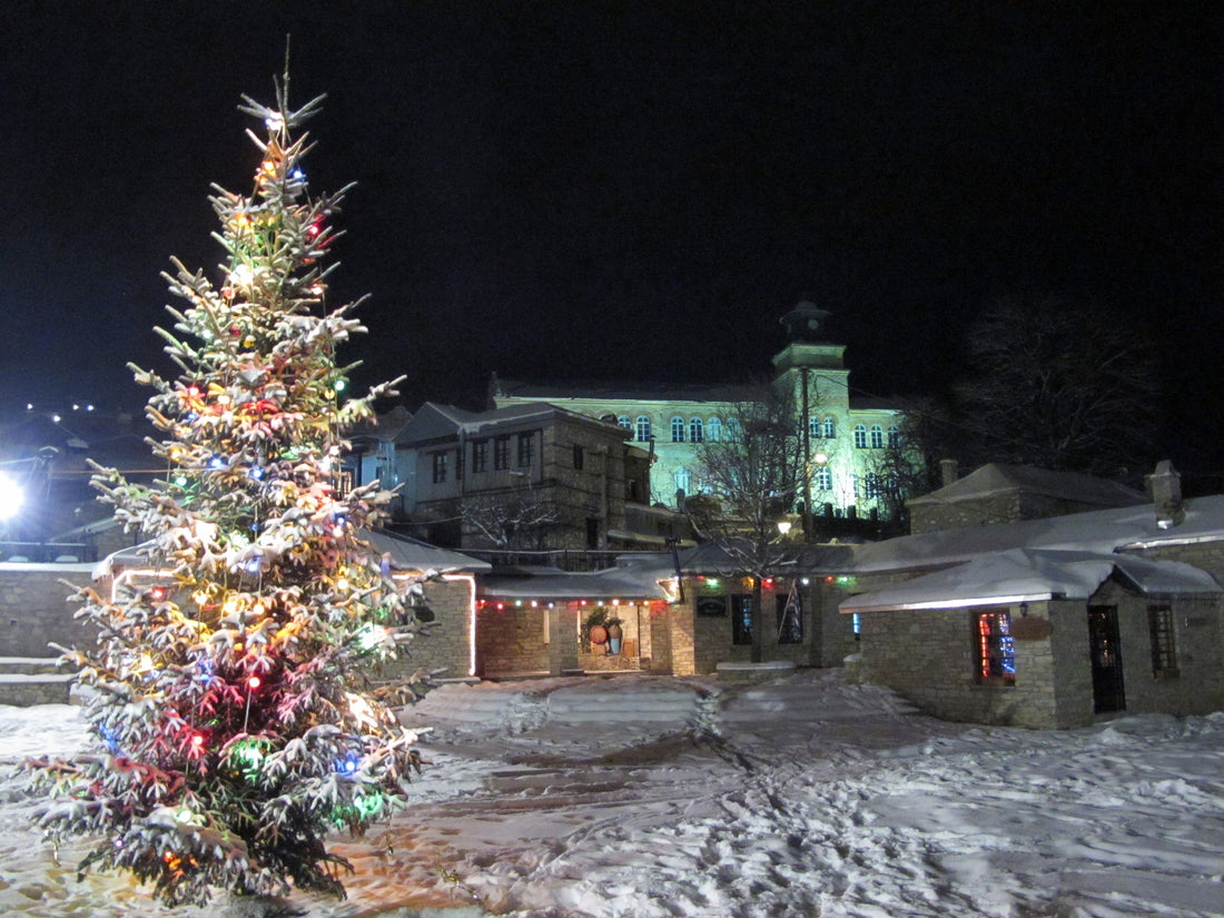 The stone village of Nymfaio under snow at night, Florina, Greece