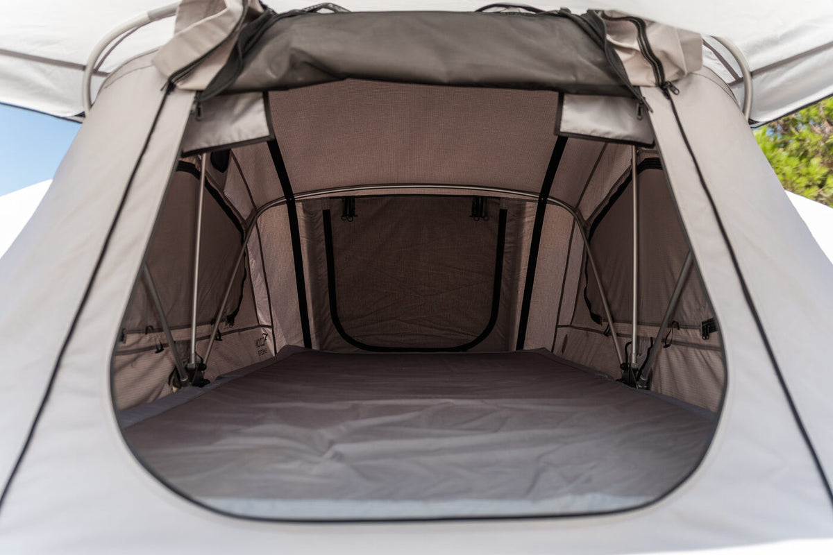 Inside the Feldon Shelter Crow's Nest roof top tent, showing the sleeping area and mesh windows