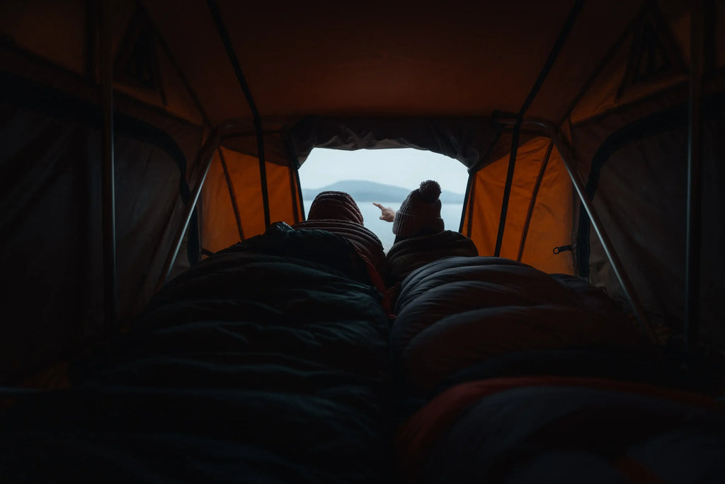 Jimny Blue interior with traveler at sunrise — CamperJimny 4×4 overlanding rental in Greece