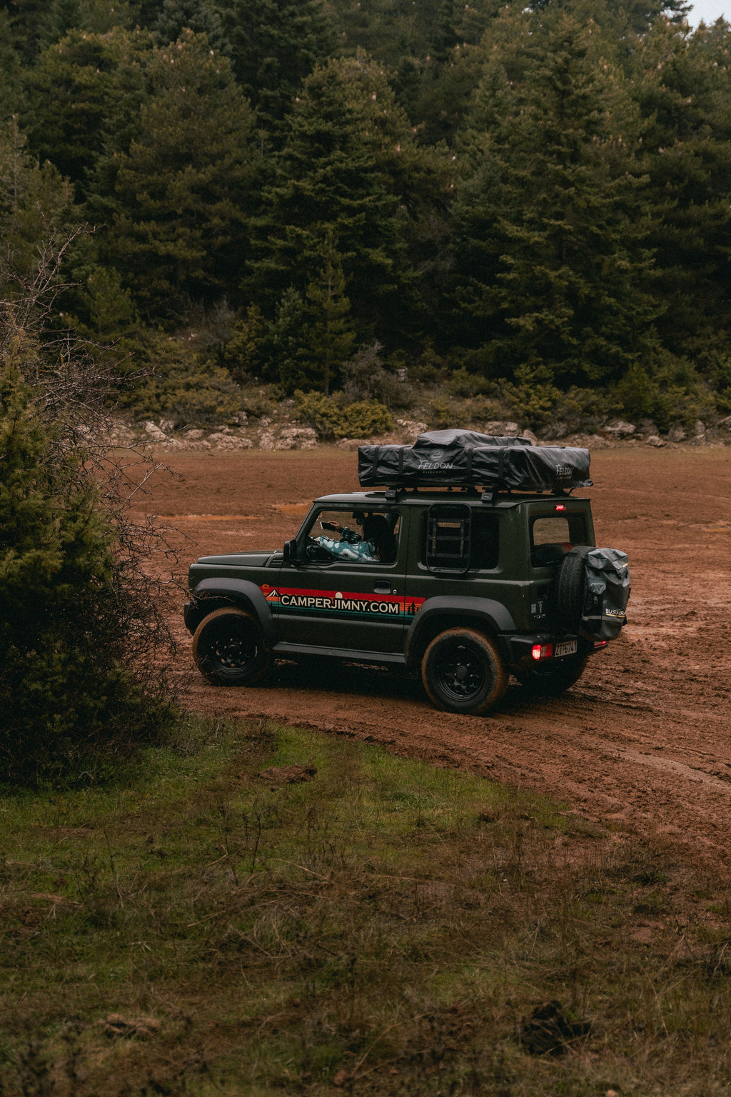 A Suzuki Jimny on a forest track in the mountains of Evia
